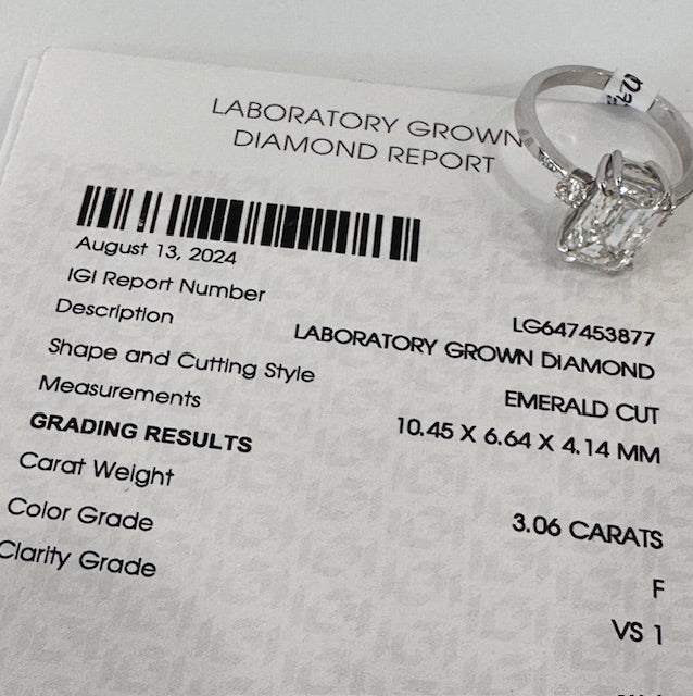 Certificate of lab grown emerald cut engagement ring
