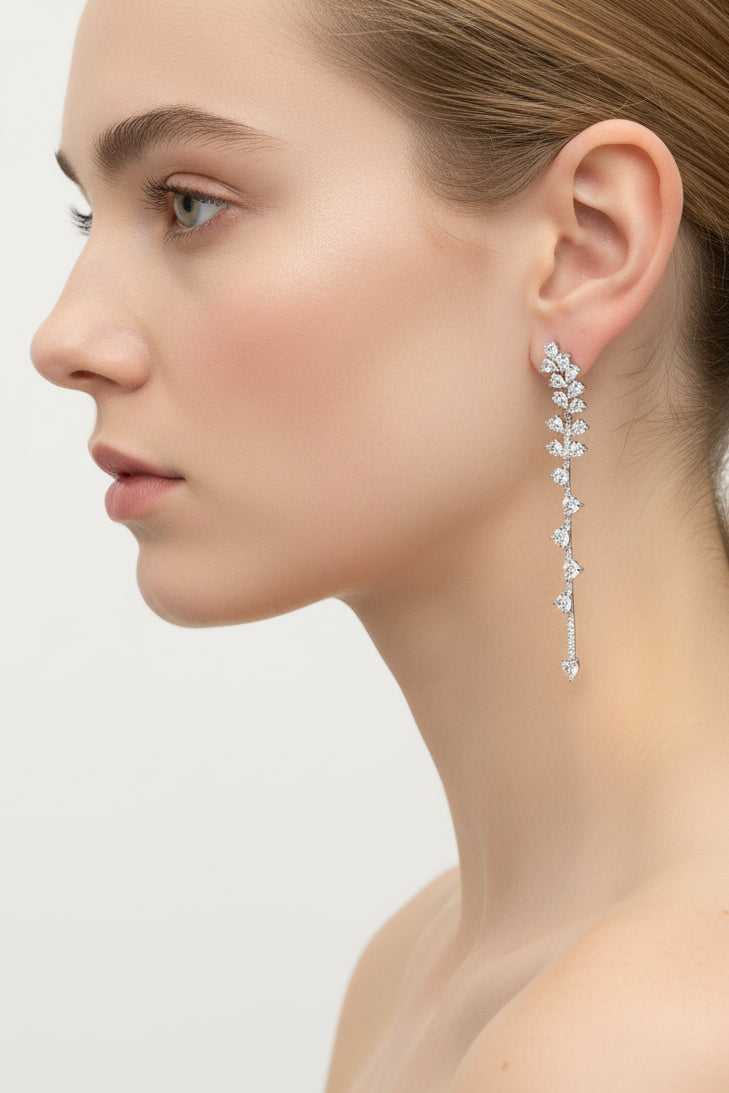 long diamond earrings on female model