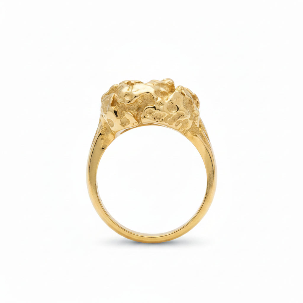 side view of a yellow gold nugget ring on white background