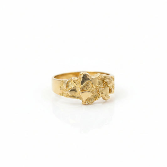 gold nugget ring on white background
