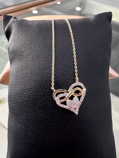 1/8 CTW natural diamond and yellow gold heart necklace