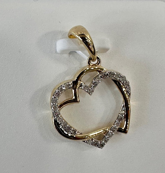 Diamond and gold pendant hearts hugging
