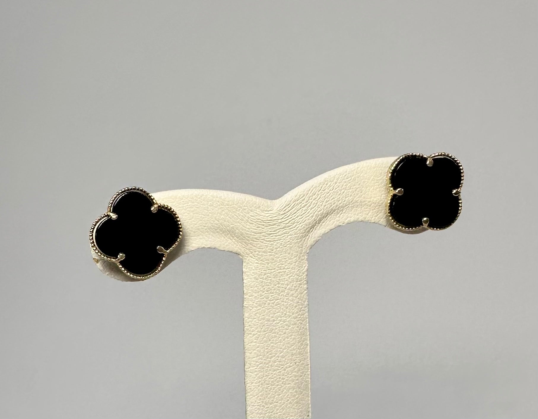 yellow gold and black clover studs