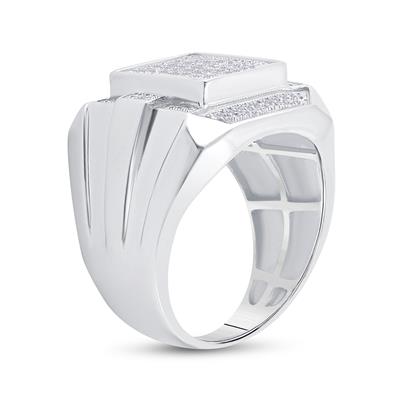Silver ring with a textured band and small stones on a white background
