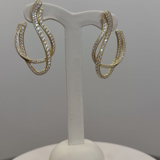 video of gold color dangle earrings