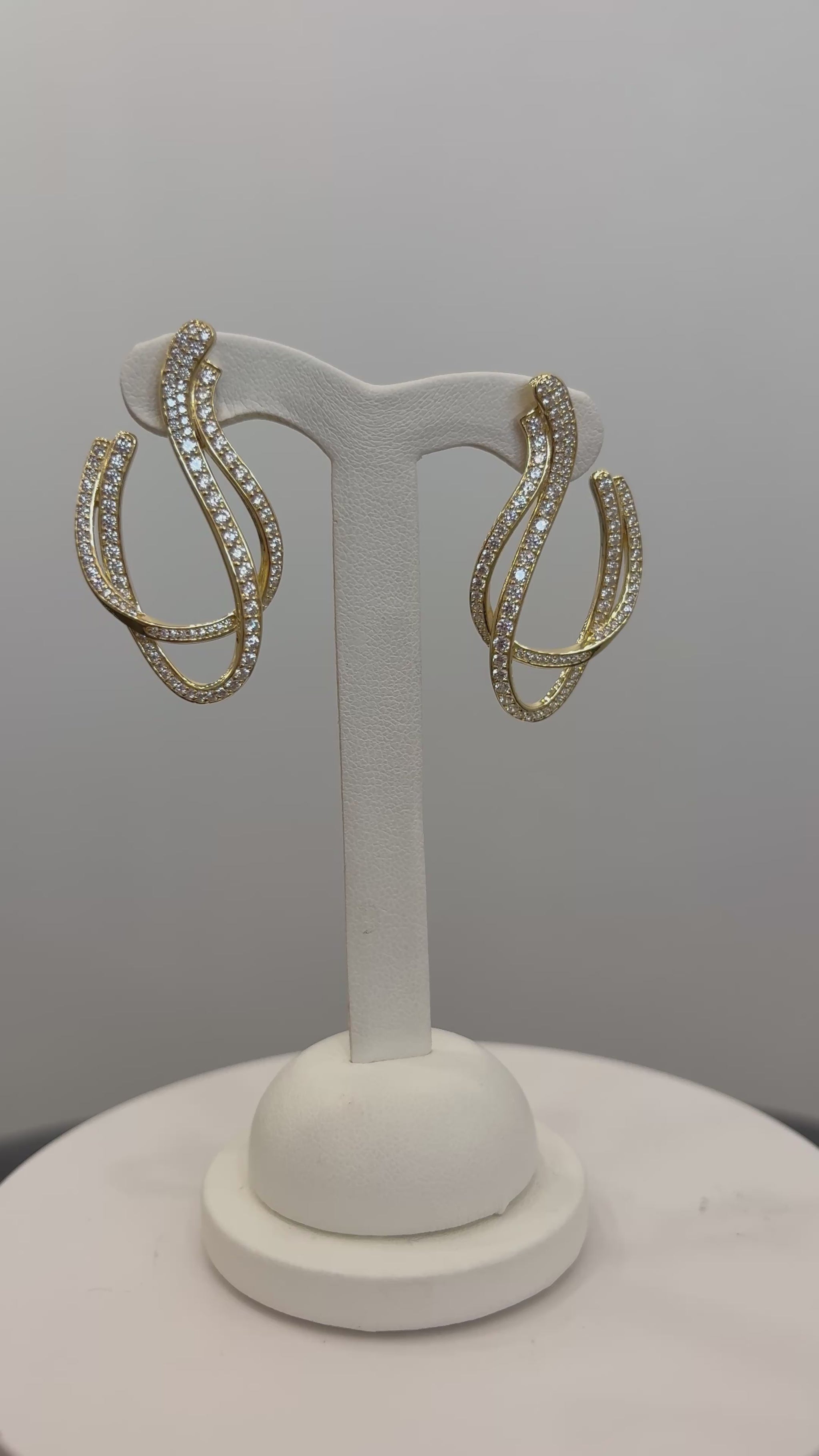 video of gold color dangle earrings